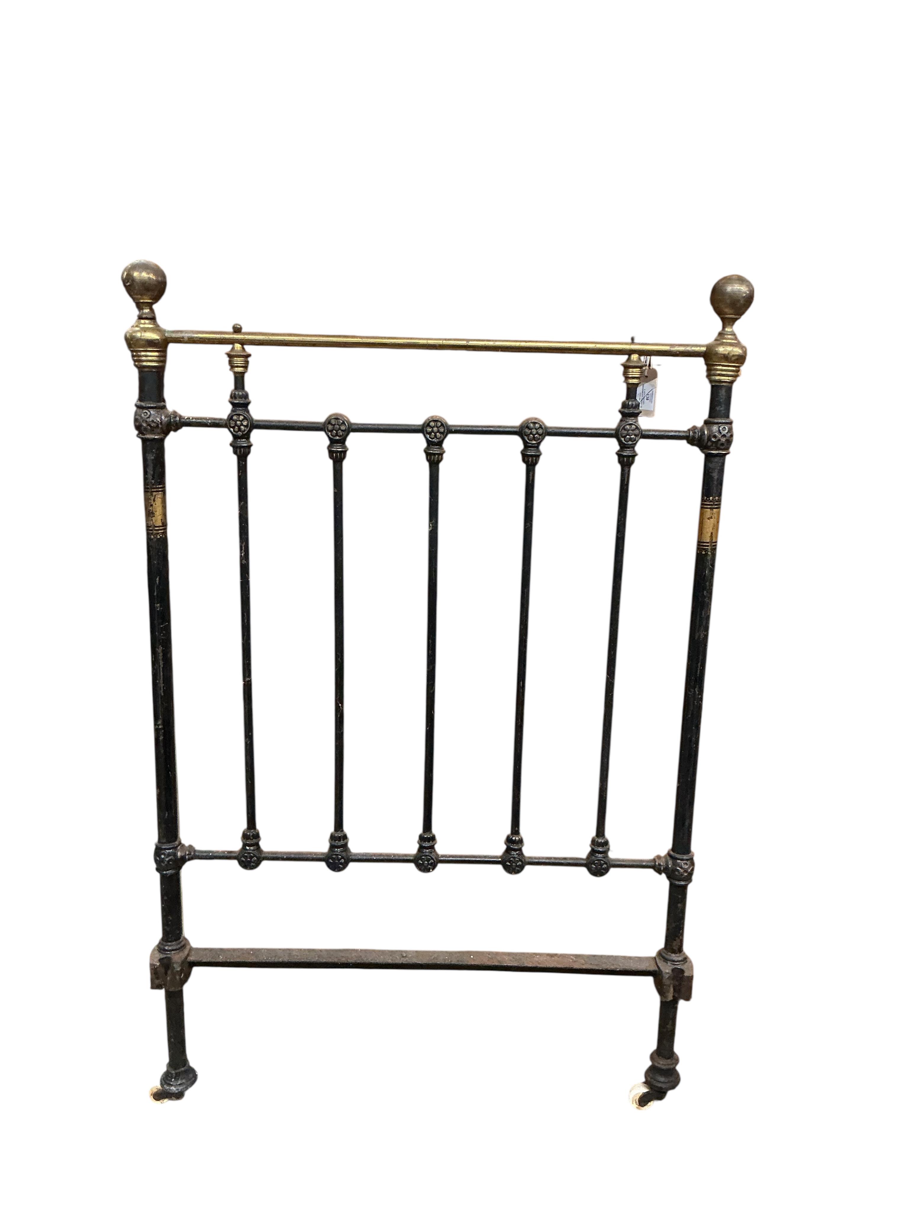 A pair of Victorian brass mounted cast iron single bed frames, each width 91cm, height 142cm